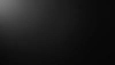 A soft grey light bleeds in from the top left of an otherwise flat matte panel, leaving the right two thirds completely clear.