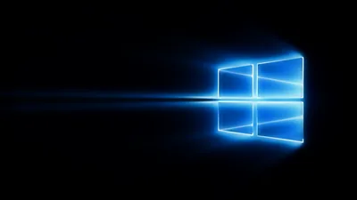 The logo glows a cold blue on pure black, one thin horizontal streak of light running out from it to the left edge.