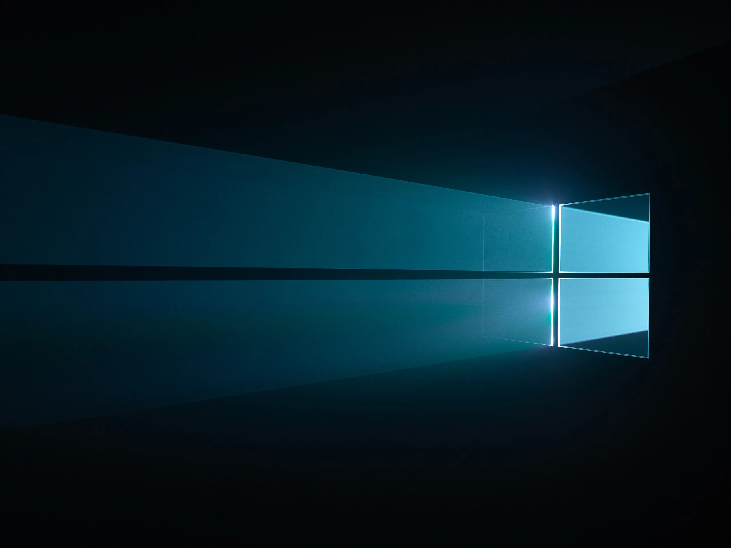 The Windows 10 hero window throws a wide teal beam across a dark reflective floor, the source sitting to the right of centre.