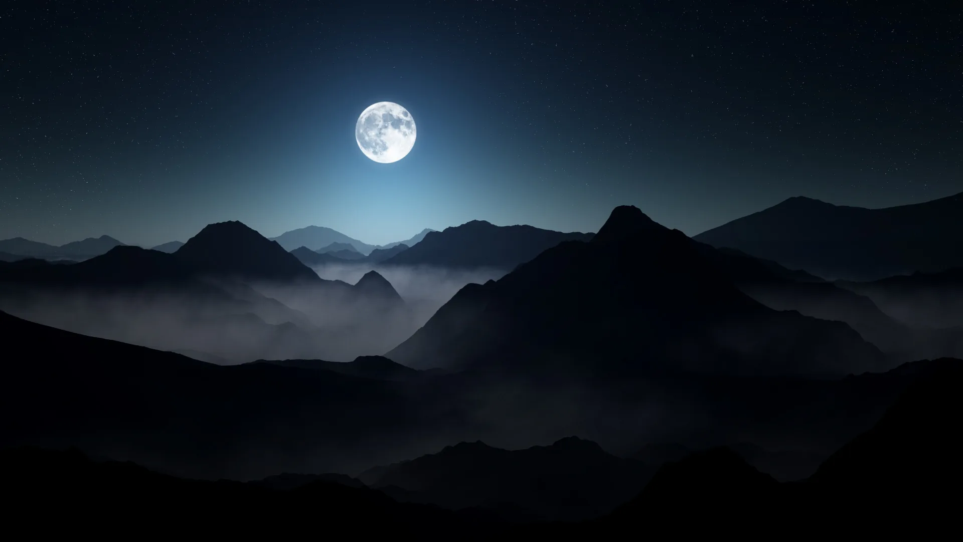 Fog pools between dark ridgelines under a small bright moon, each layer of hills fading lighter toward the horizon.