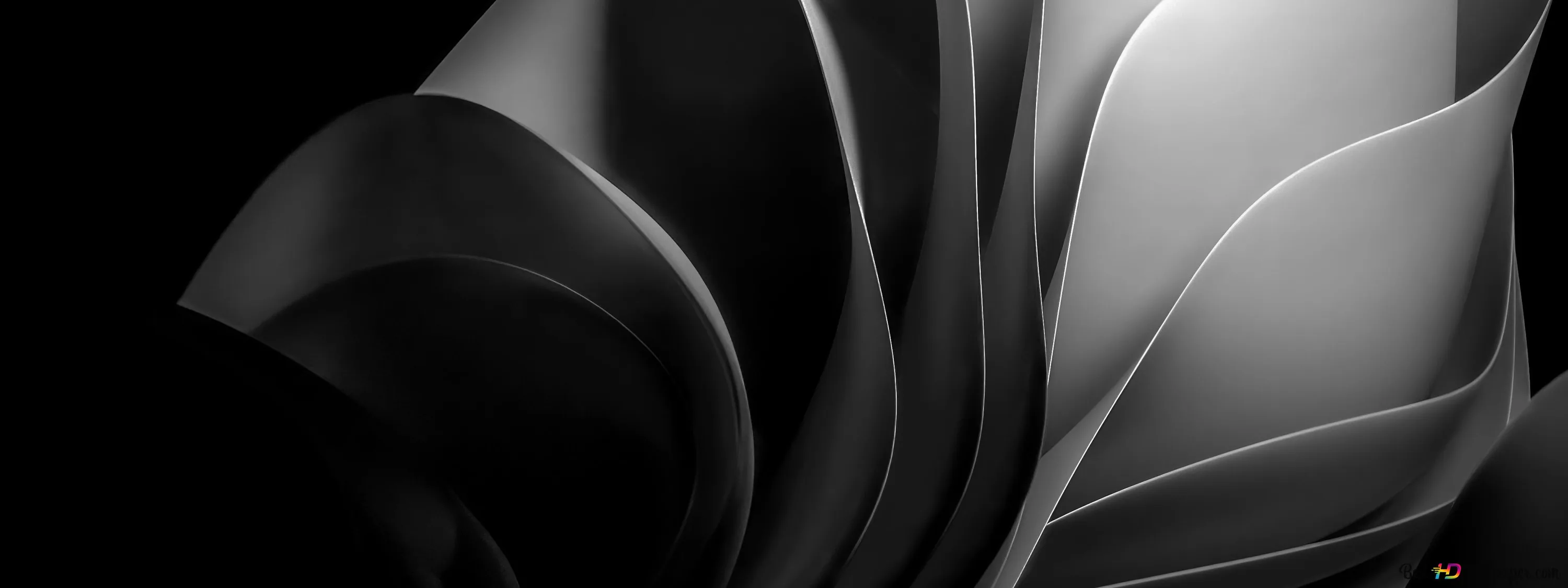 Layers of pale grey material curl across a wide frame, the right side lit and the left dropping to black.