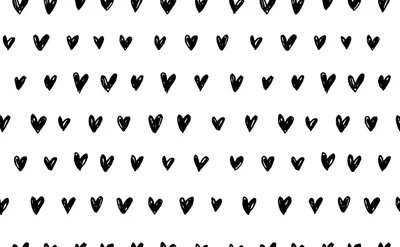 Rows of small hearts painted in rough black brush strokes across a plain white sheet, each one slightly different in shape.