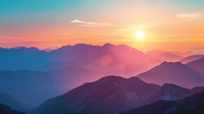 The sun flares at top right over layers of violet ridges, a lens streak crossing the middle of the frame in warm orange light.