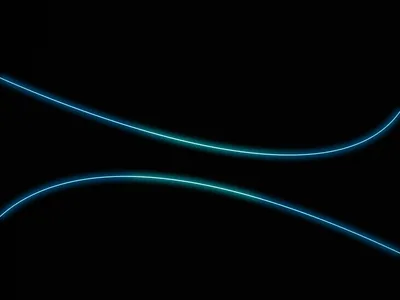 Two long strands of blue-green light sweep across the frame in shallow curves, brightest where they cross the centre and fading into black at the corners.