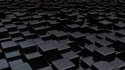 Rows of glossy black cubes recede toward the horizon at different heights, each top face catching a little light.