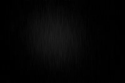 Thin brushed streaks run top to bottom across a near-black field, a weak glow gathering just above centre before the edges close in.