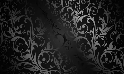 A repeating floral damask sits on charcoal, the edges of the frame darkened by a heavy vignette so the middle reads brightest.