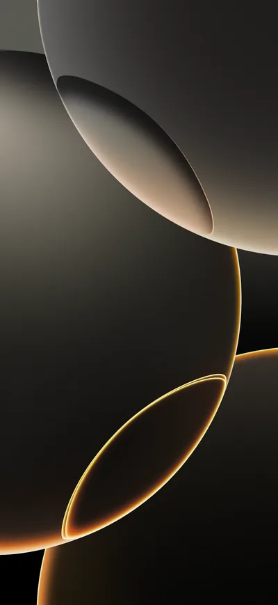 Two dark spheres and a thin gold ellipse sit against near-black, lit only along their edges — the stock look that ships on the iPhone 16.