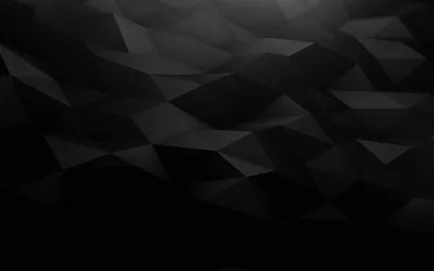 Flat triangles tile the whole frame in graphite and black, lightest near the top right corner and sinking to solid black along the bottom.