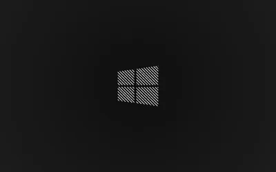 The four-pane mark is filled with a fine hatched texture and set small on a plain charcoal field.
