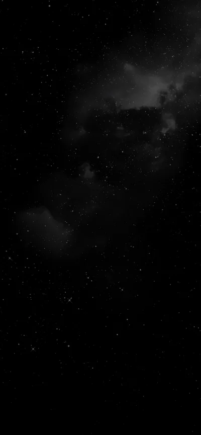 Grey cloud gathers through the upper half of this tall frame and breaks apart lower down, letting stars show through the gaps.