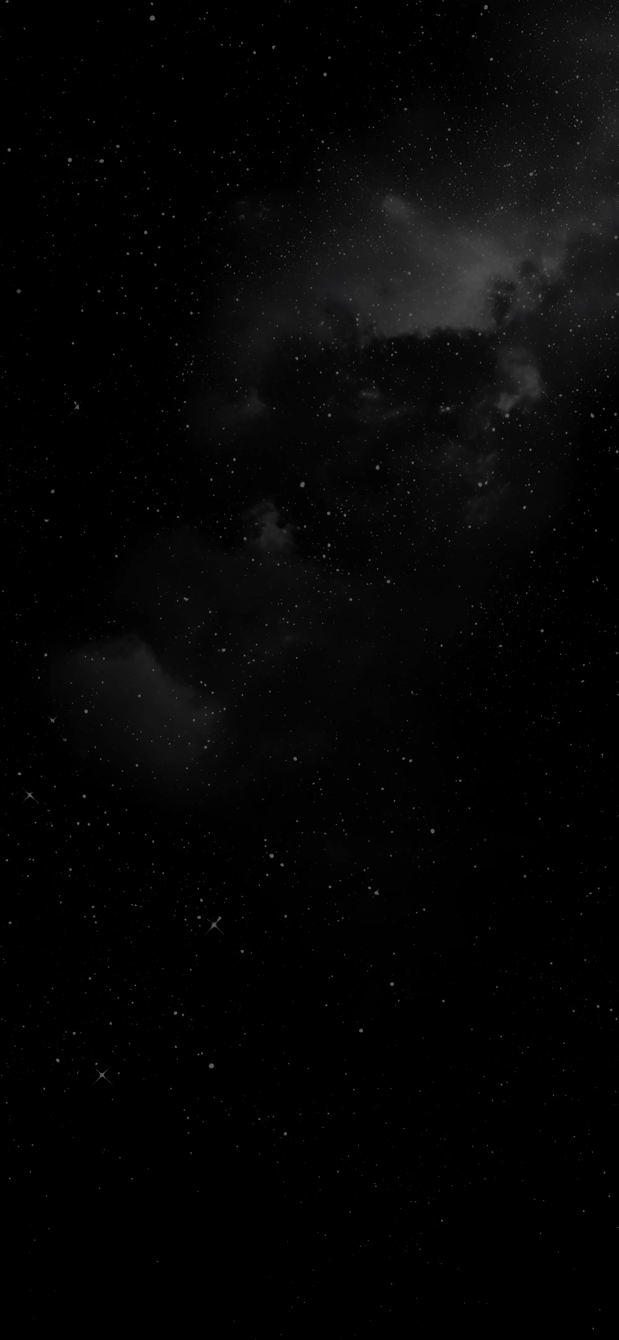 Grey cloud gathers through the upper half of this tall frame and breaks apart lower down, letting stars show through the gaps.