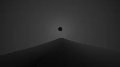 A small black disc hangs above a smooth grey ridge, the sky lightening only where the slope meets it.