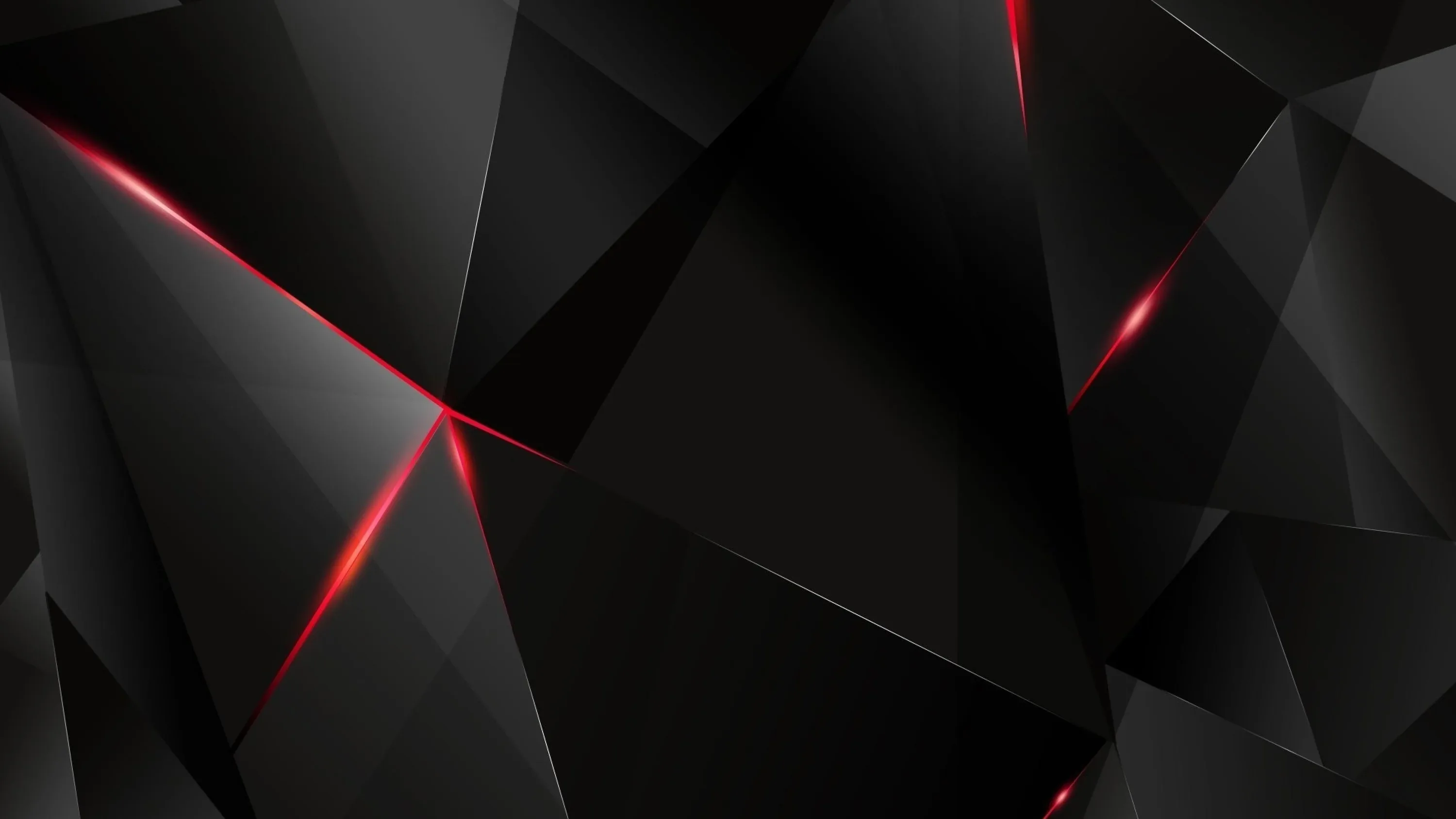 Angular black facets fill the frame with red light burning through the seams where the planes meet.