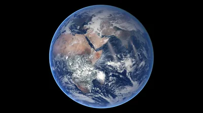 Deserts glow tan across Africa and the Arabian Peninsula on a blue full-disc globe, centred with even black space on every side.