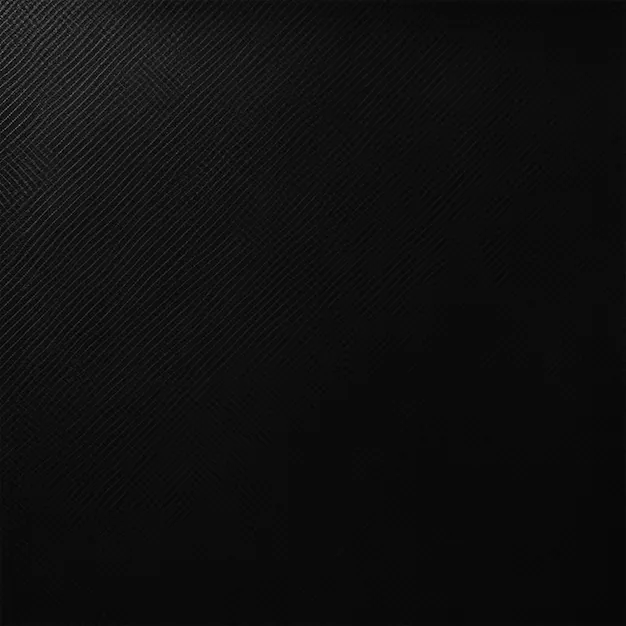 A square field of woven carbon fibre angled to the left, the weave catching light along the top and upper left before the corners go fully black.