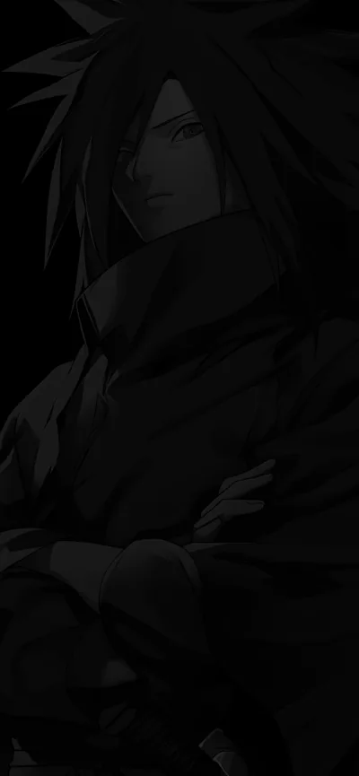 A tall phone-shaped crop where a folded-arm figure in armour is only just readable, most of the frame given over to unbroken black.