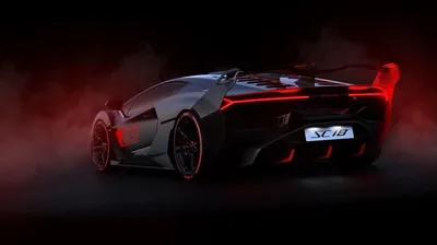 The one-off track car seen from behind in a dark room, red haze catching its tall wing and roof scoop while thin red lines outline every vent.