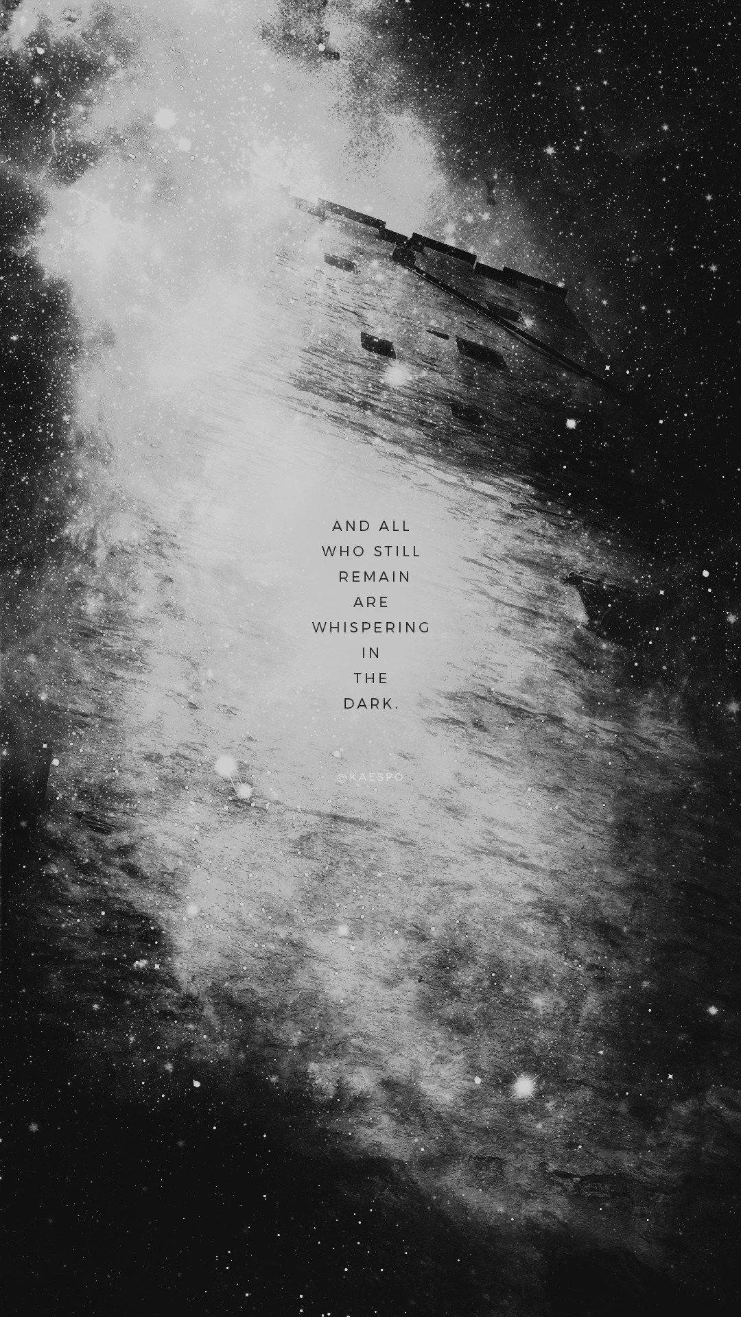 Smoke rolls up a bare ridge in grainy monochrome, with a small block of faint centred text sitting in the calm middle of the frame.