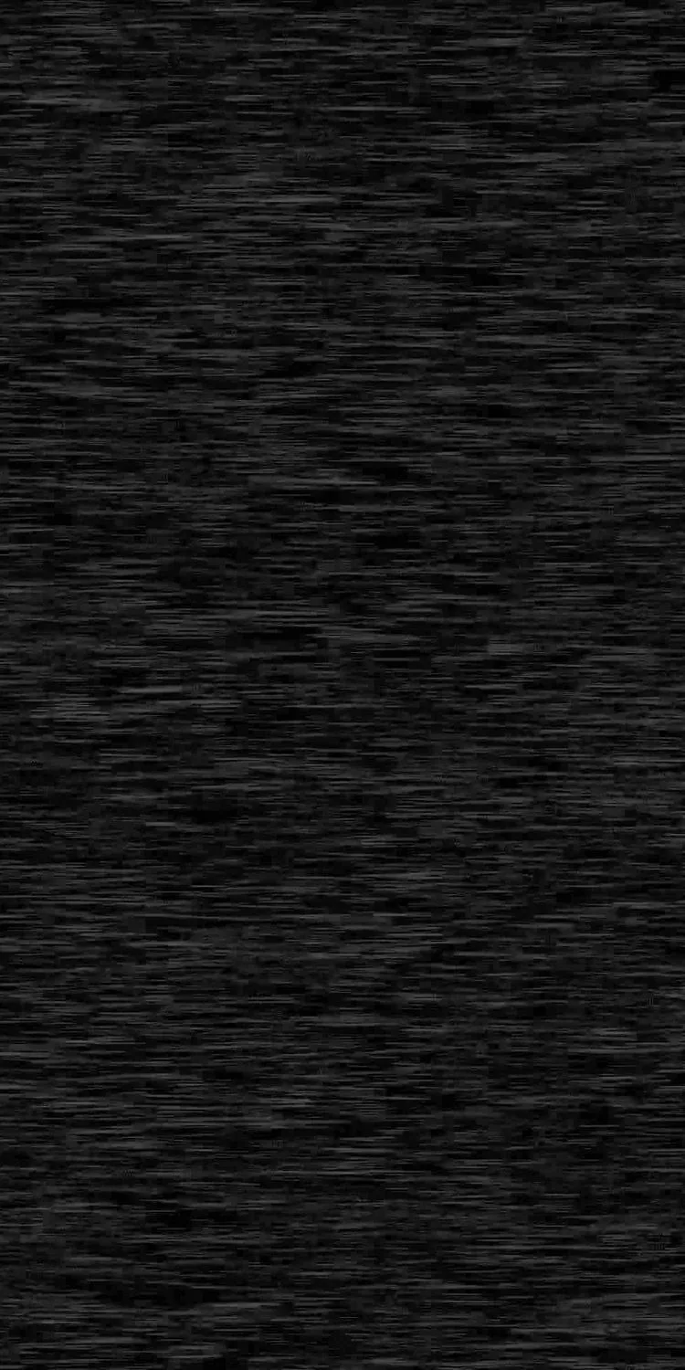 Dense vertical grain packed edge to edge in a narrow frame, the fine grey streaks reading almost like brushed metal at a distance.