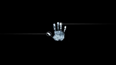 A pale handprint glows at the centre of a black frame, a thin horizontal line running through it.