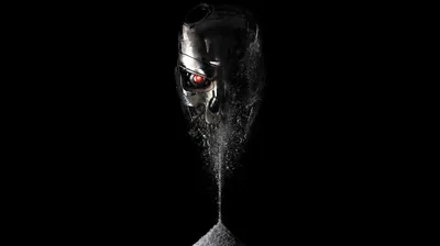 A metallic helmet with red eyes breaks apart at the jaw, a stream of grains pouring into a pile below.