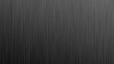 Fine vertical brushing runs top to bottom across a mid-grey panel, dimming slightly toward the lower left, with no focal point to fight your icons.
