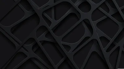 Overlapping charcoal panels are cut into rounded shapes, casting soft shadows into the gaps behind them.