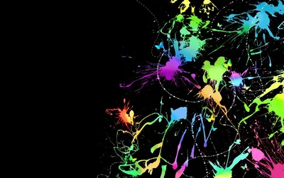 Green, pink, blue and orange paint flicks across the right half of a black background, thin trails and stray droplets spraying toward the corners while the left stays empty.