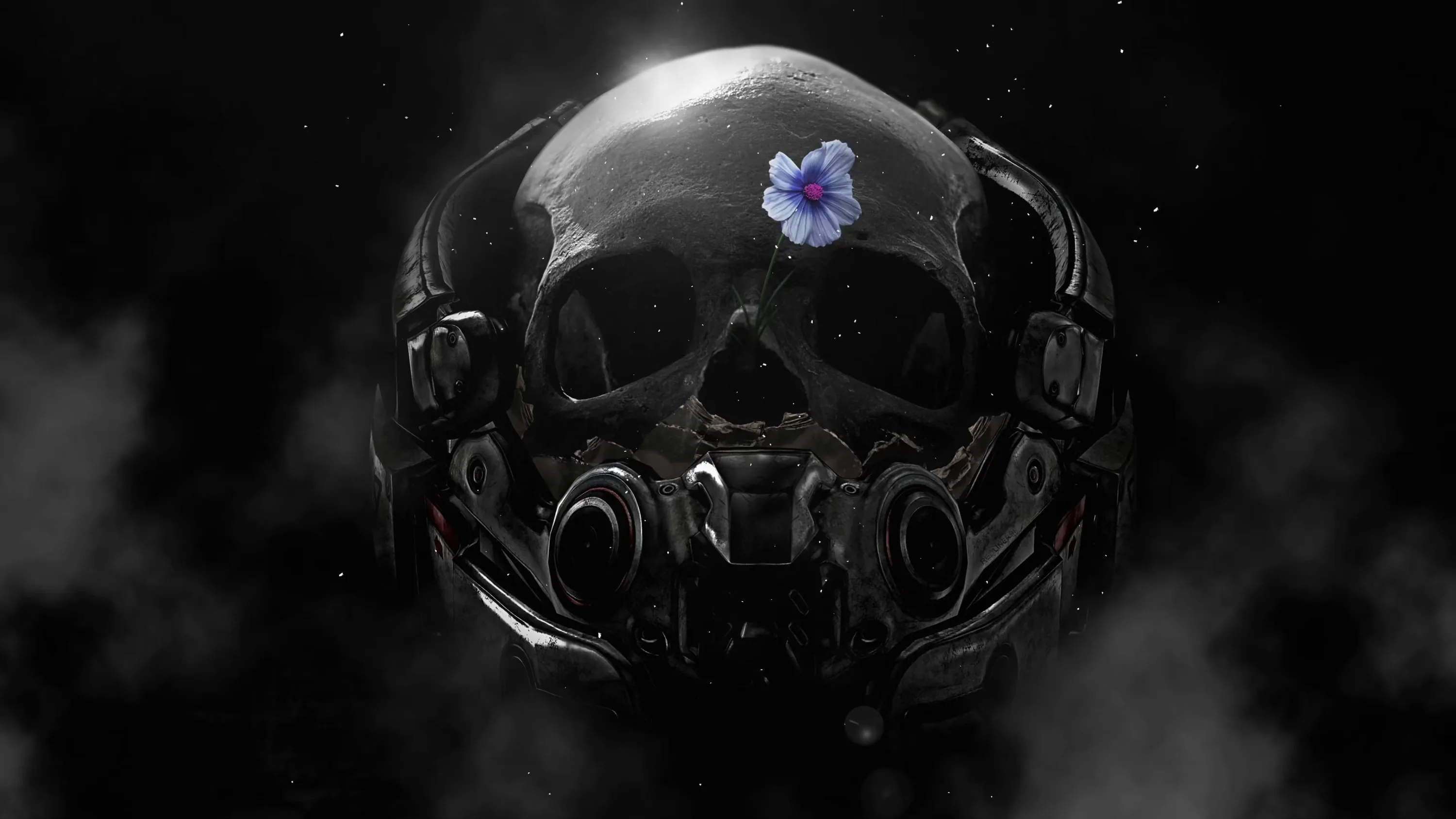 A metal-plated skull sits in thin smoke with one small blue-violet flower resting on its crown, the only colour in the frame.
