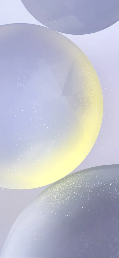 Three frosted lilac spheres stack down the frame, the middle one rimmed in yellow light from below, with fine grain that only shows up close.