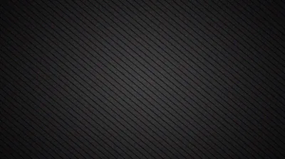 Fine diagonal stripes run corner to corner over a charcoal surface, the weave tightening near the top so the lower half reads almost solid.