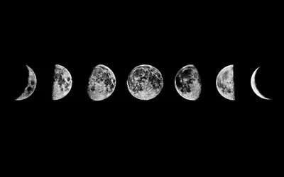 Seven lunar phases line up in a single row across a black field, from crescent to crescent, with empty dark space above and below.