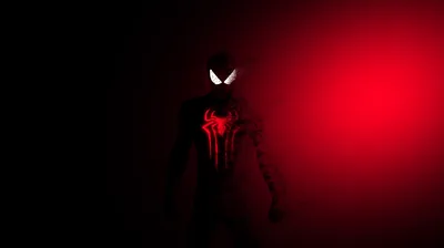 Spider-Man stands almost entirely in shadow, only the white eyes and chest emblem catching light as a red glow spreads in from the right.