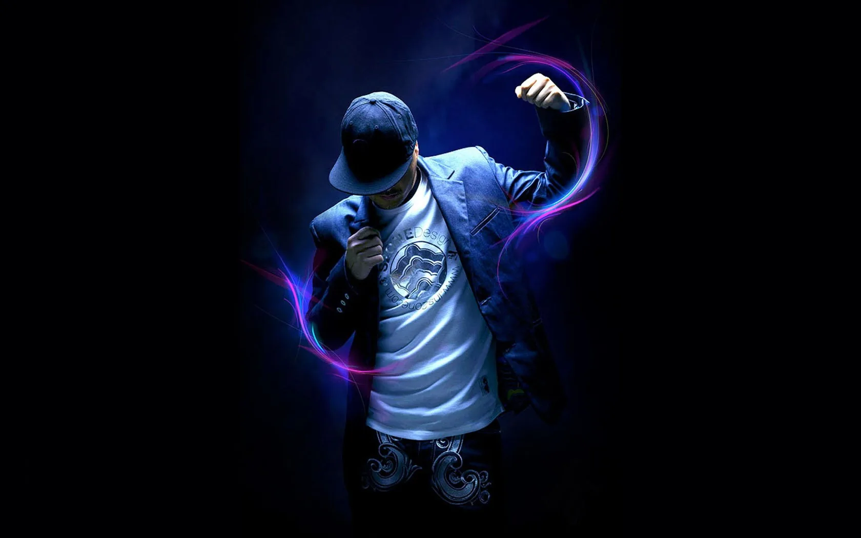 A boy in a denim jacket and cap dances while ribbons of purple and blue light curl around his arms on a near-black stage.