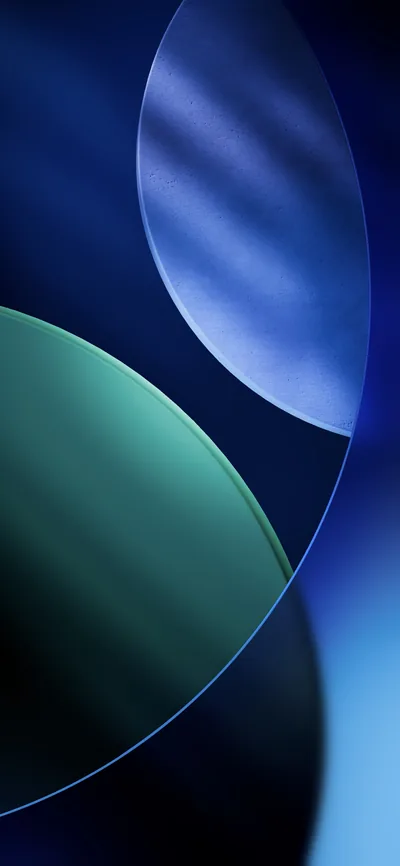 Two large translucent circles, one deep blue and one teal green, cross over a midnight blue background in the iOS 26 stock style.