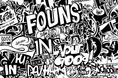 Layered marker tags, cartoon faces and bubble letters cover every inch of the wall in pure black outline on white.
