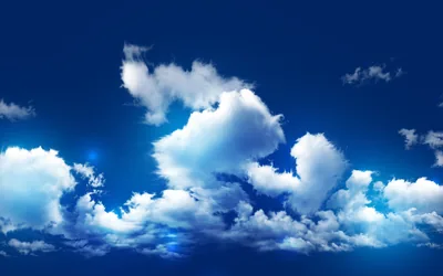 Glowing white cumulus clusters drift across a saturated royal-blue sky, the deepest blue held at the top where status-bar text stays sharp.
