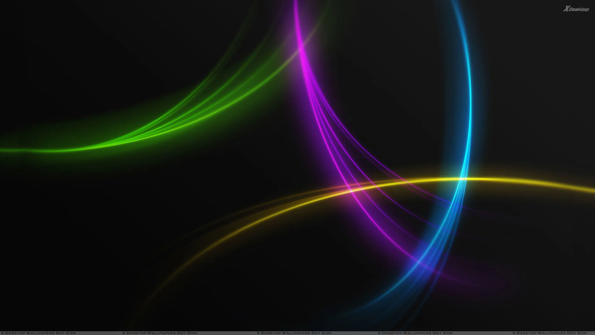 Green, magenta, blue and gold arcs sweep across a dark grey field, crossing near the centre.