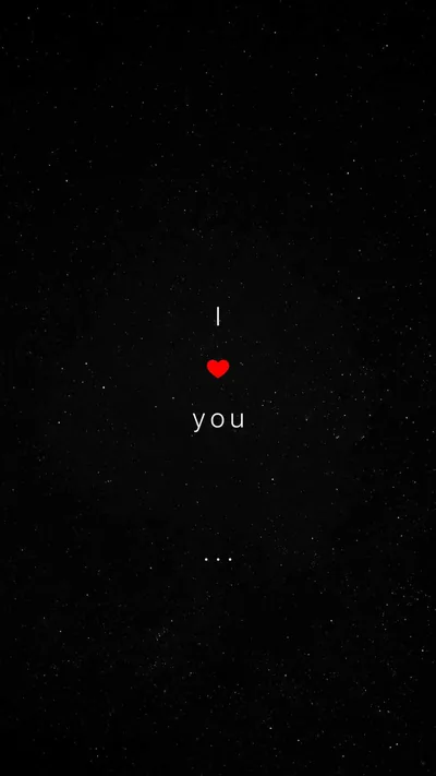 The words I love you sit small and centred on a grainy near-black field, a single red heart the only colour in the frame.