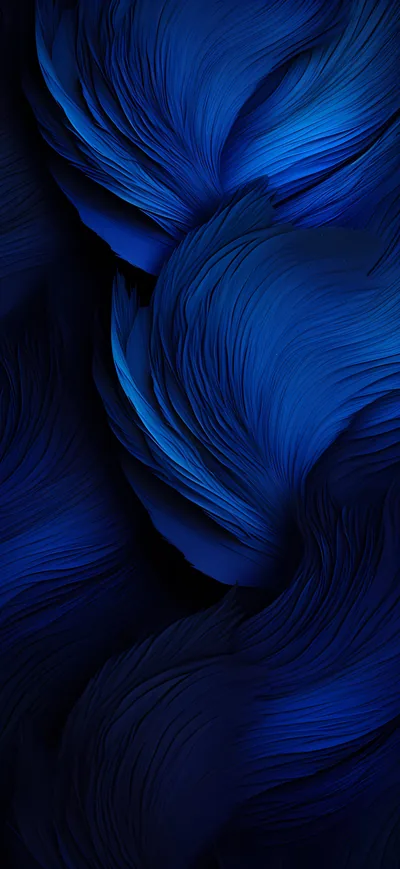 Fine brushed strands curl into feather-like whorls, cobalt where the light catches them and almost navy-black in the hollows.