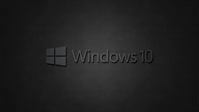 The grey Windows flag and Windows 10 wordmark centred on a woven dark fabric texture that fades toward black at the edges.