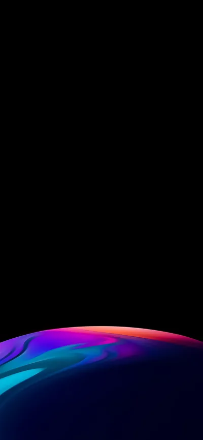Most of the frame is solid black, with a curved band of rainbow light rising from the bottom edge like the rim of a lit sphere.