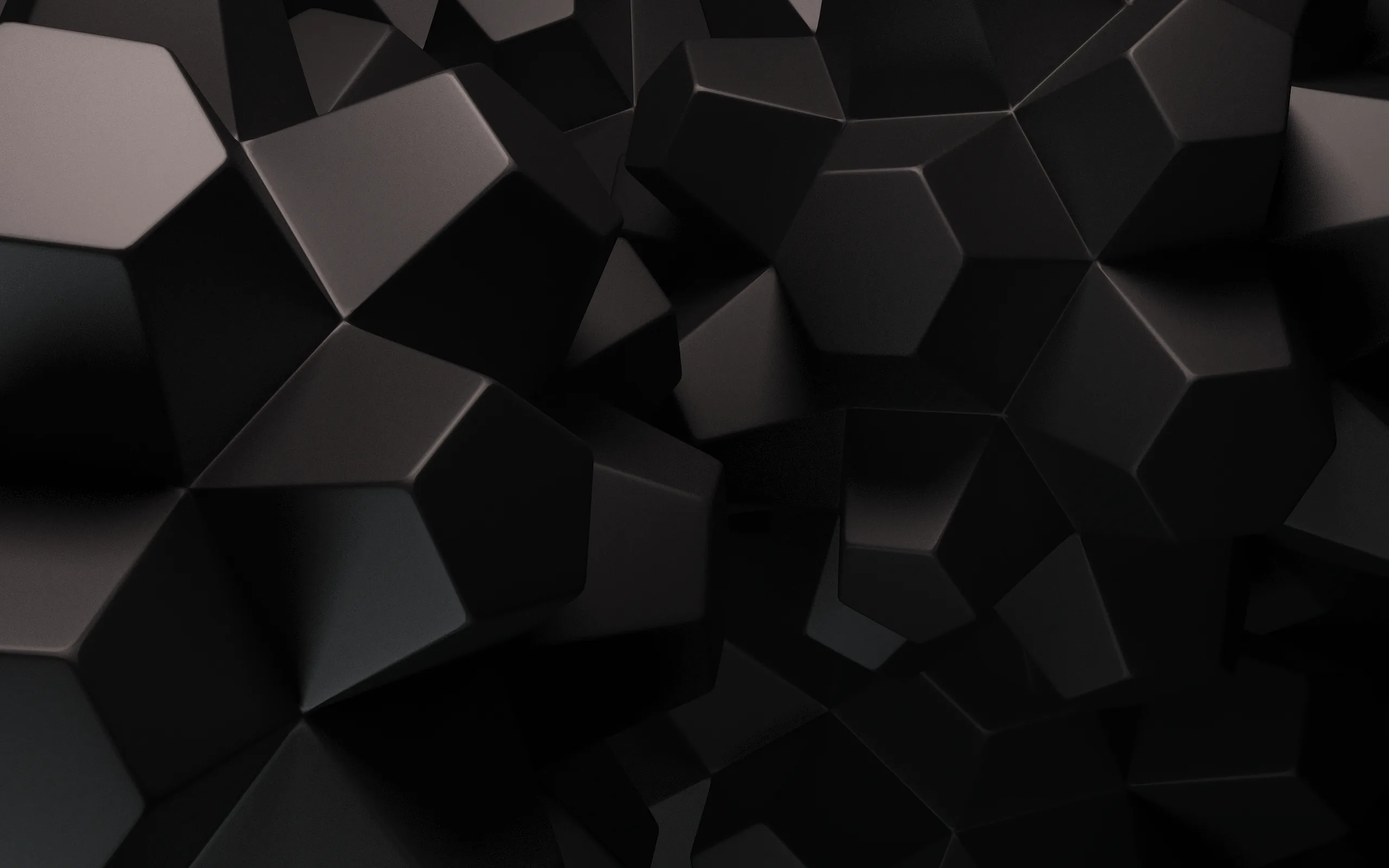 Chunky faceted blocks crowd toward the viewer in matte black, gaps between them opening into deeper shadow near the top edge.