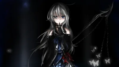 She stands in a black dress with a hand near her mouth, pale blue butterflies drifting up the right side of a near-black room.