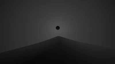 A small black sphere hangs above the tip of a smooth grey peak, the rest of the frame given over to an even dark gradient.