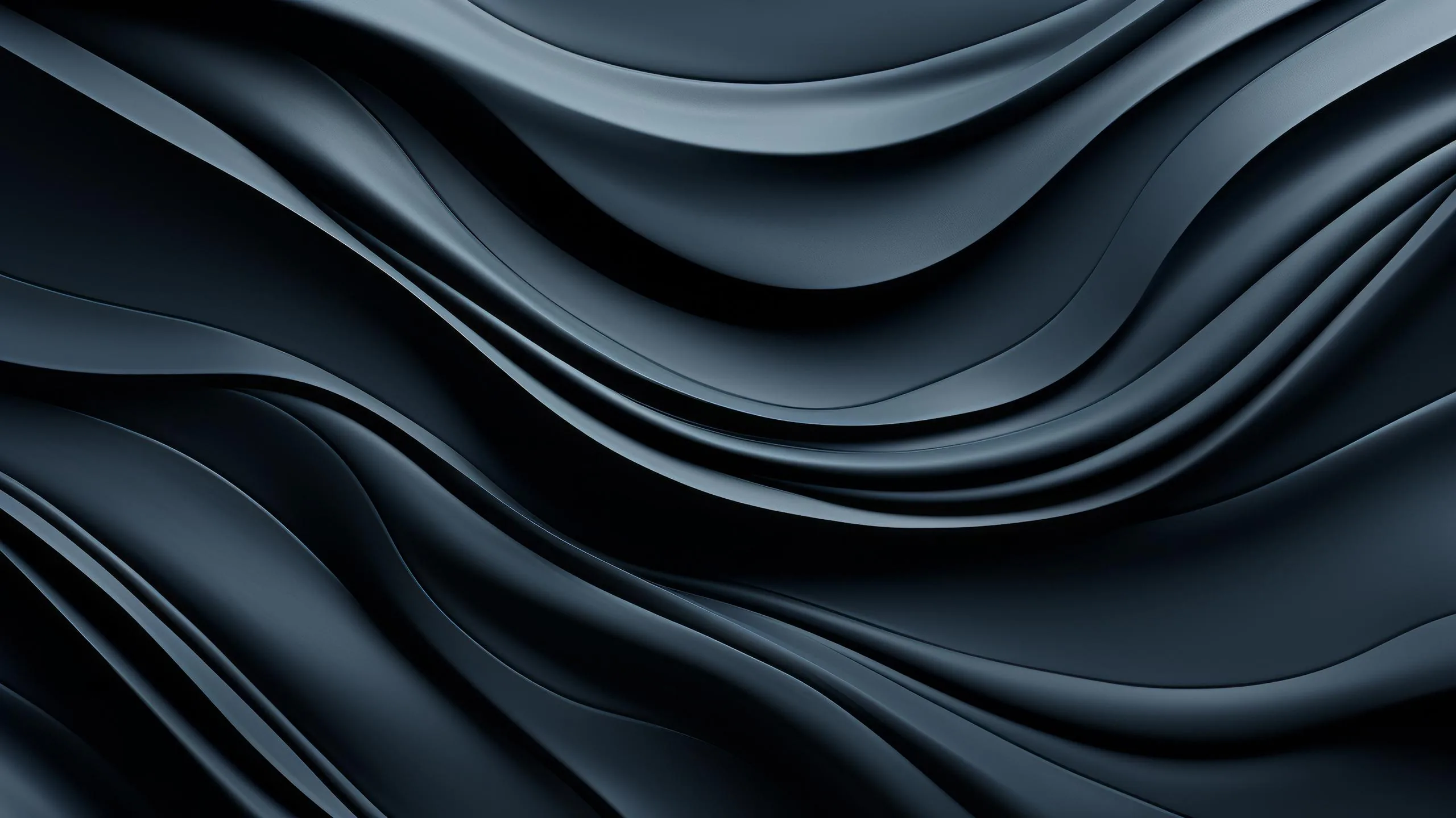 Heavy navy folds ripple across the frame like draped silk, catching a cool sheen along each crest while the troughs stay in shadow.