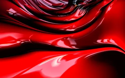 Thick red material ripples in wet-looking folds, the highlights so sharp the surface reads more like poured lacquer than fabric.