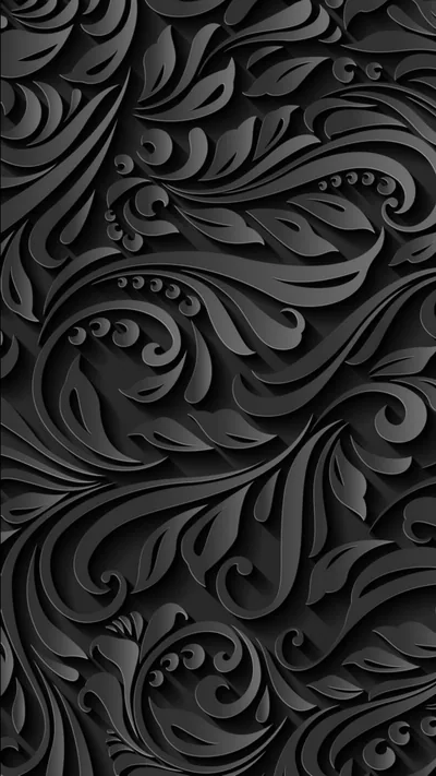 Thick acanthus curls and dotted spirals fill the frame in grey relief, every hollow holding a pocket of deep shadow.