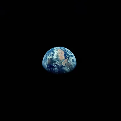 A small gibbous Earth floats just above centre in a sea of true black, most of the square frame left empty for AMOLED displays.